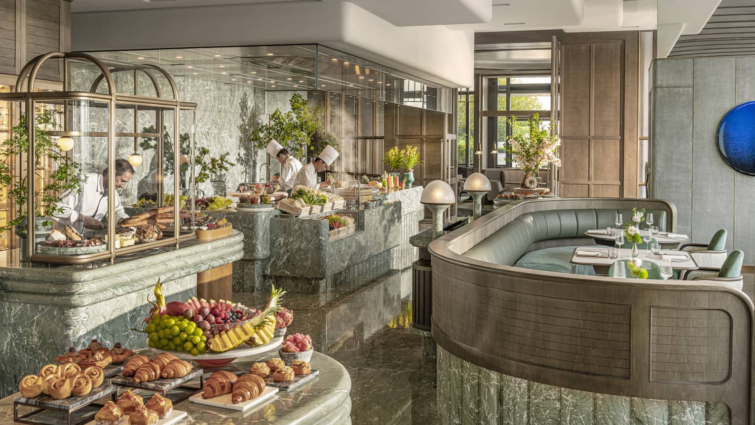 Chefs work at live-cooking stations at all-day restaurant Charm at Four Seasons Hotel Hangzhou at Hangzhou Centre