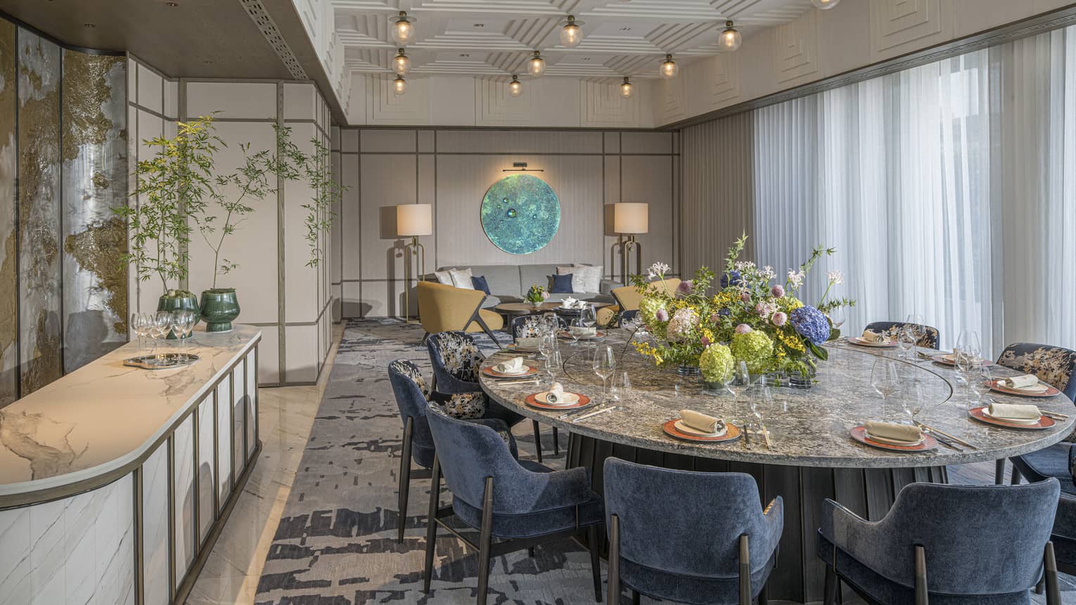 Private Dining Room with large round table and blue velvet chairs at Chinese restaurant Song, at Four Seasons Hotel Hangzhou at Hangzhou Centre