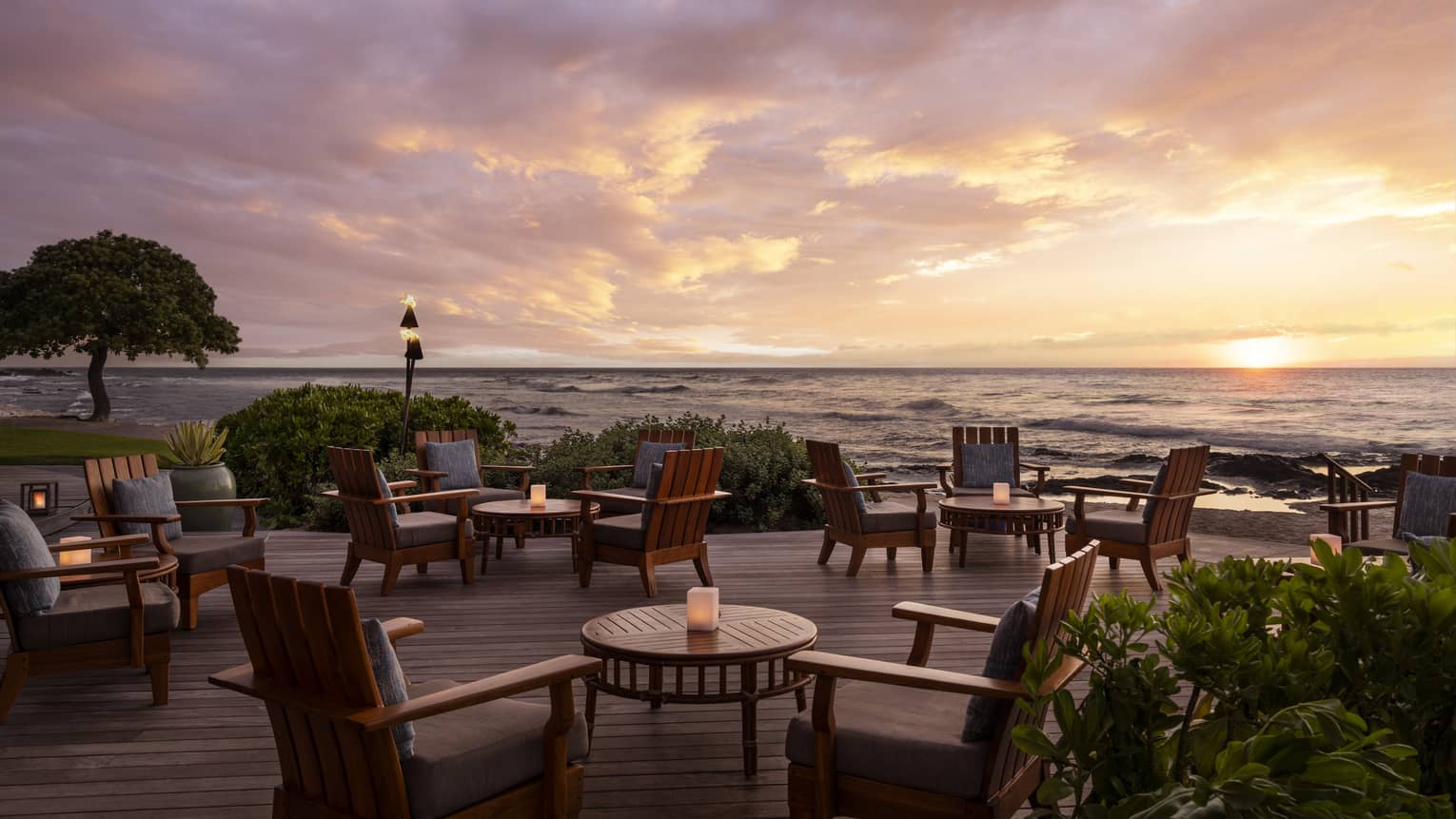 Restaurant terrace next to the ocean at sunset