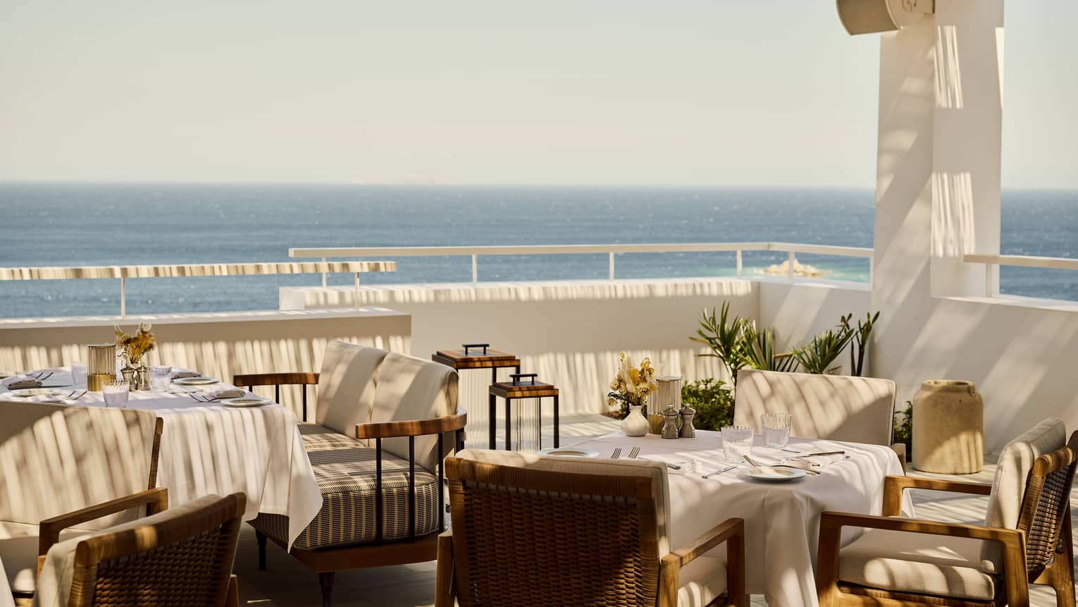 Outdoor Greek restaurant terrace overlooking the sea