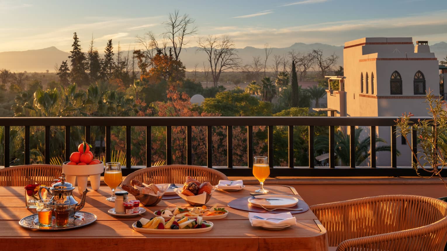 Outdoor dining table on luxury Moroccan hotel balcony