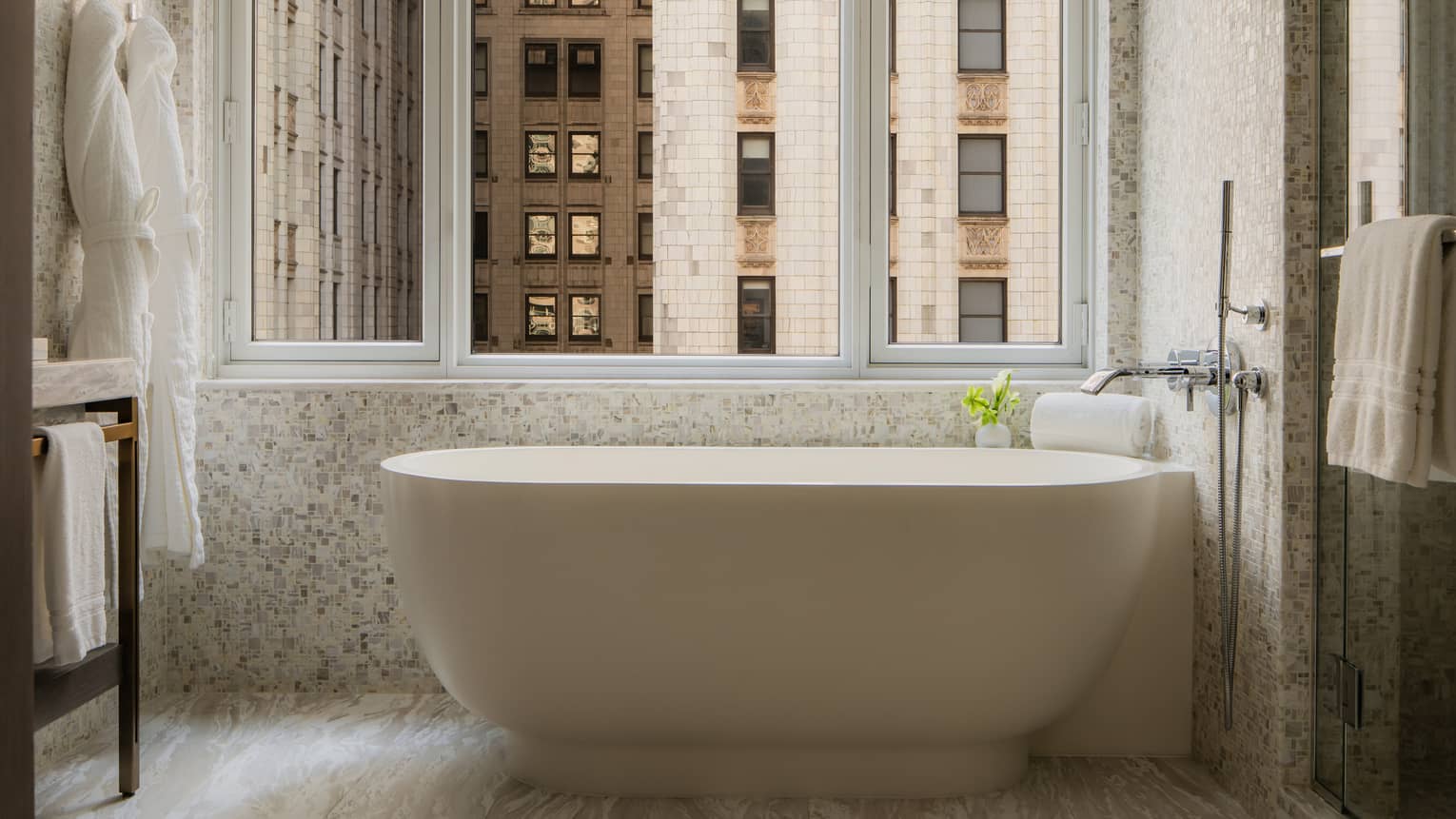 Luxury hotel bathroom with windowside deep-soaking tub