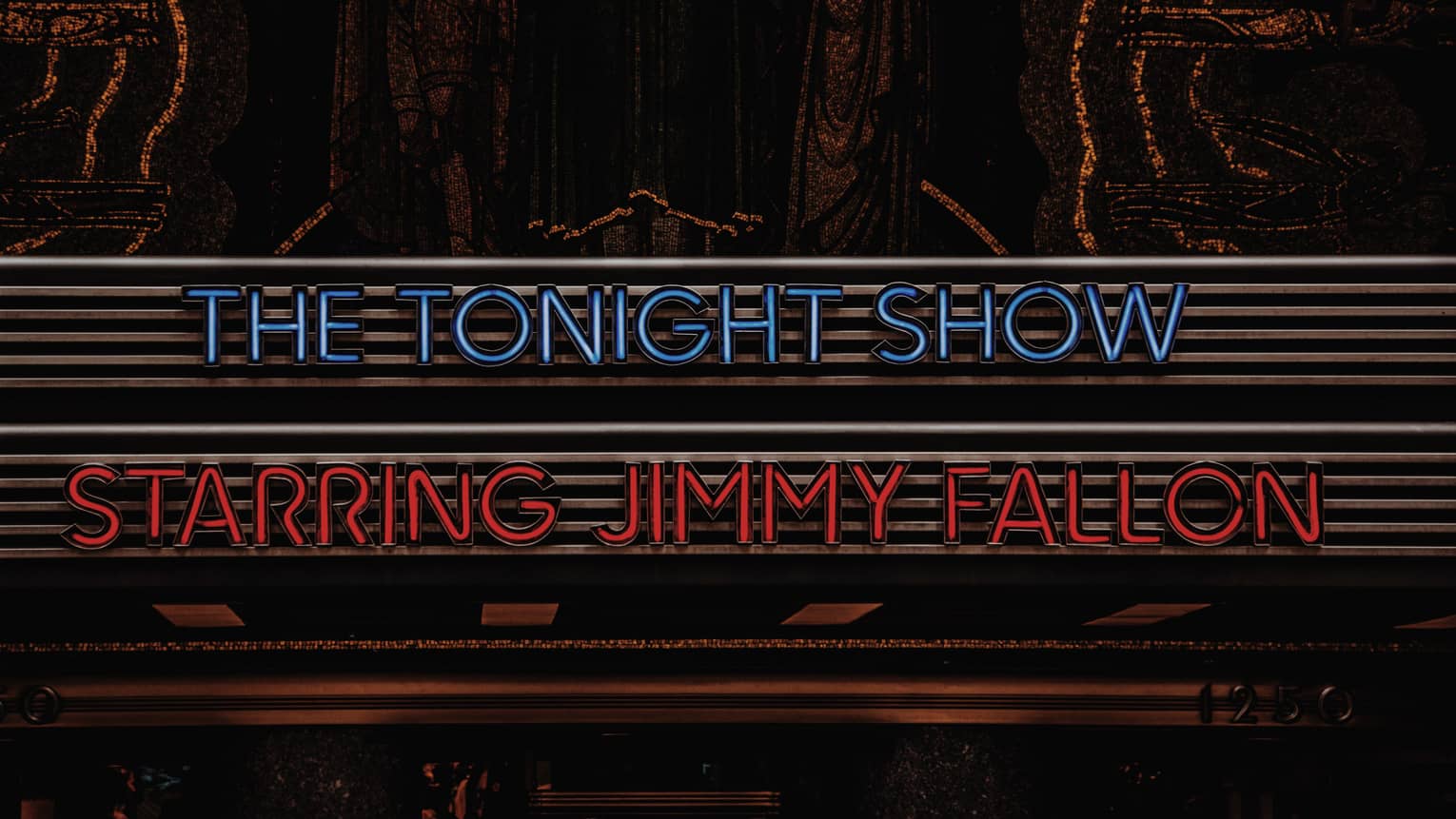 Blue and red neon signs reading The Tonight Show Starring Jimmy Fallon