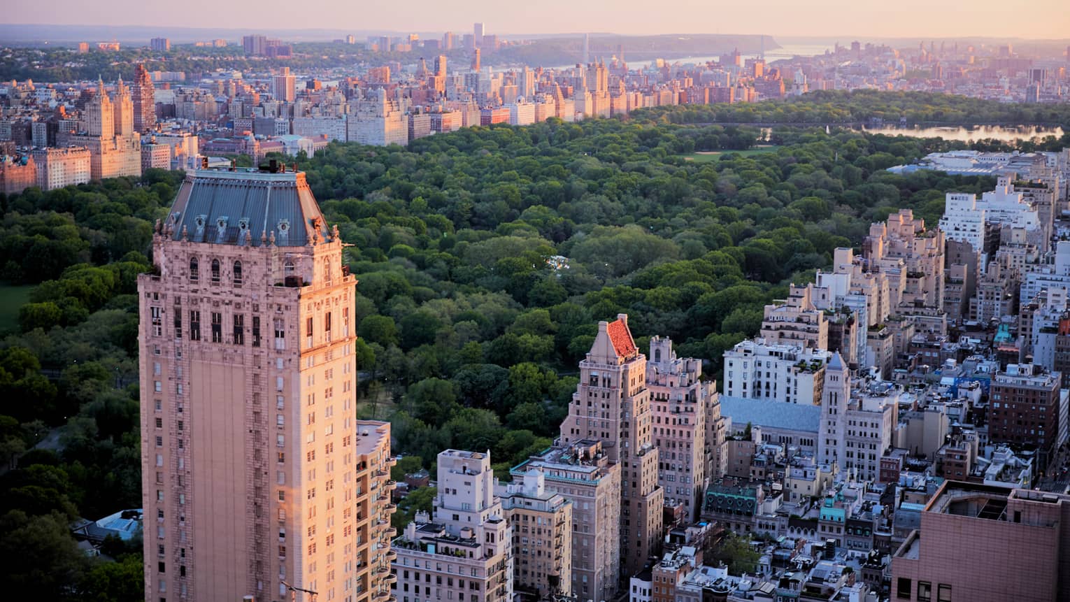 Looking down over historic buildings, Central Park in Manhattan, New York at sunset