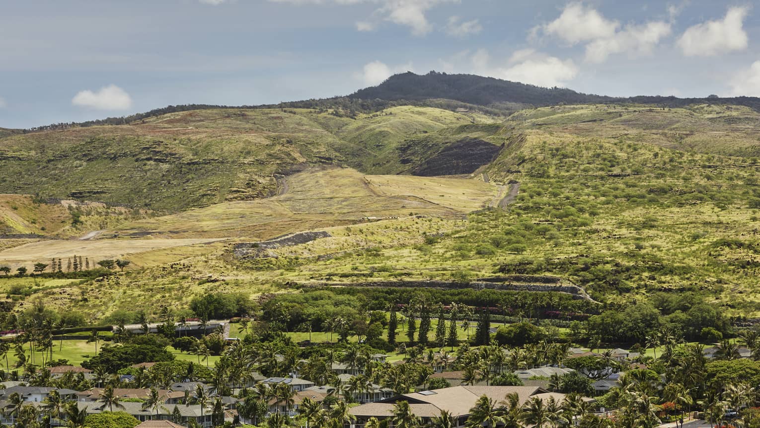Sweeping green mountain views from one bedroom suite