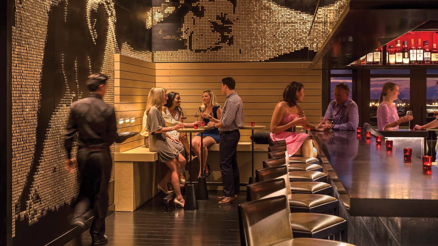 Restaurants Near Disney World Orlando Four Seasons Group Of Friends Socialize Around Capa Bar Under Mosaic Tile Wall