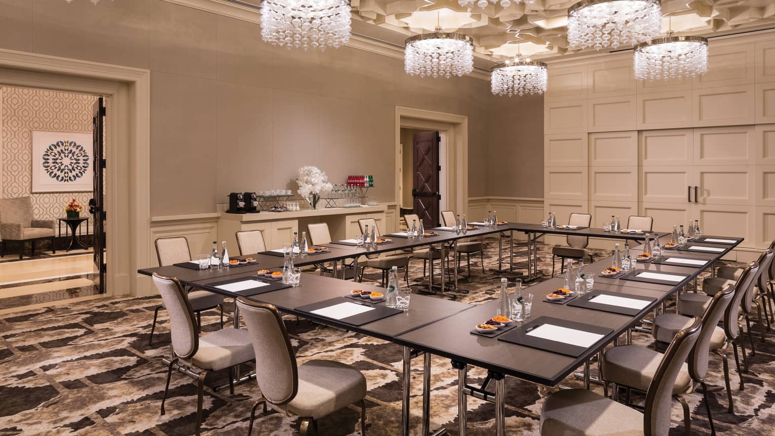 Fox Tail Hollow room with modular meeting table under small crystal chandeliers 
