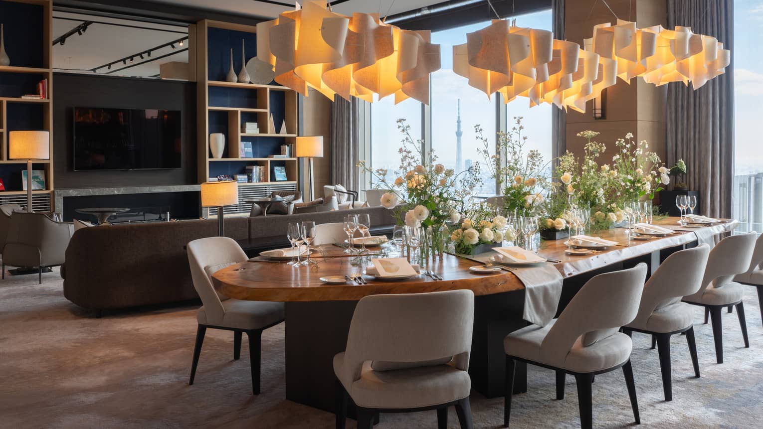 Private dining room featuring contemporary lighting fixture and table for 10 guests