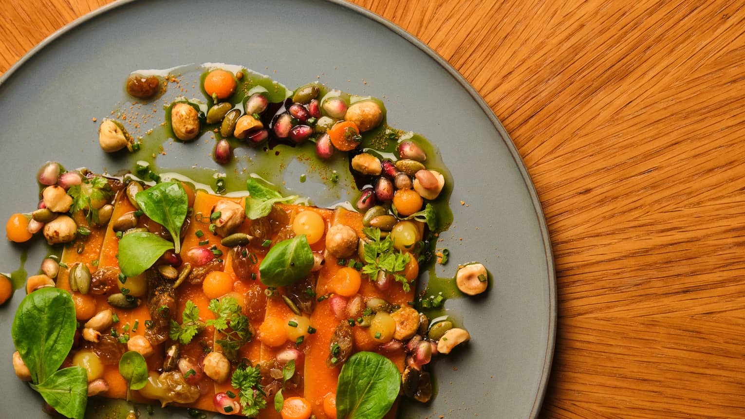 Squash dish with leafy greens on a plate