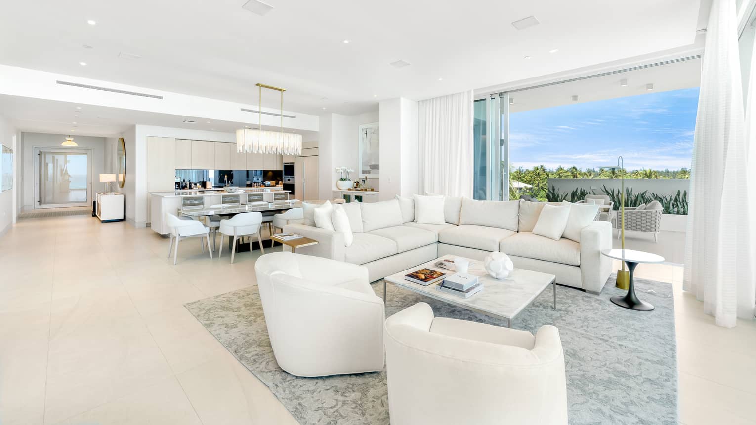 Residence interior living room and kitchen with floor-to-ceiling windows