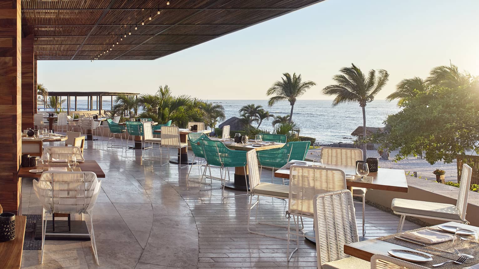 Dining tables along Dos Catrinas restaurant patio 