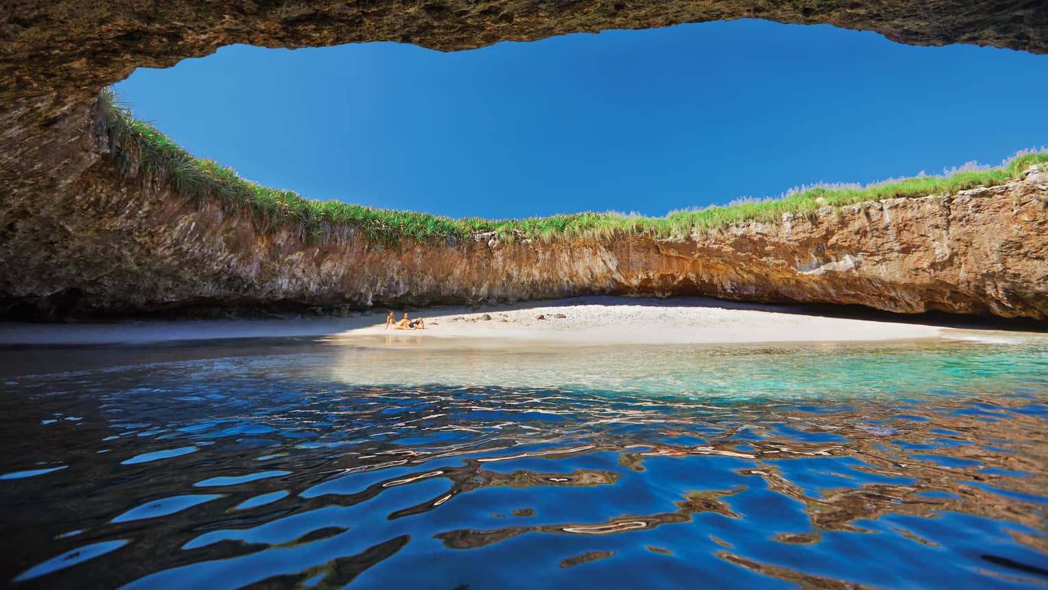 Hidden beach under opening in Marietas Islands cave