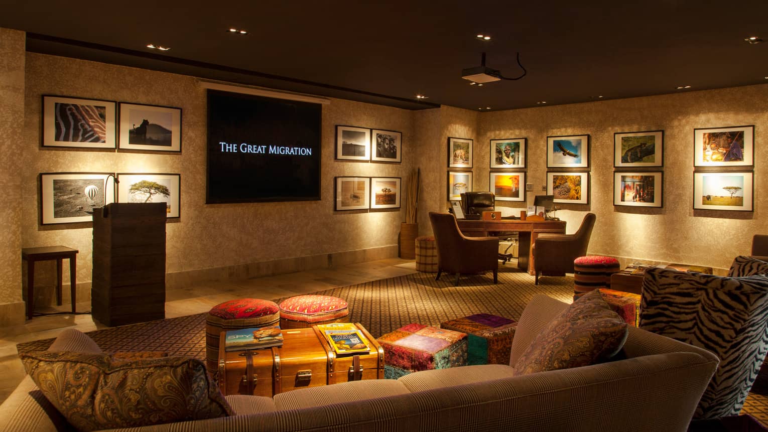 Sofas, armchairs, stacks of National Geographic magazines on table