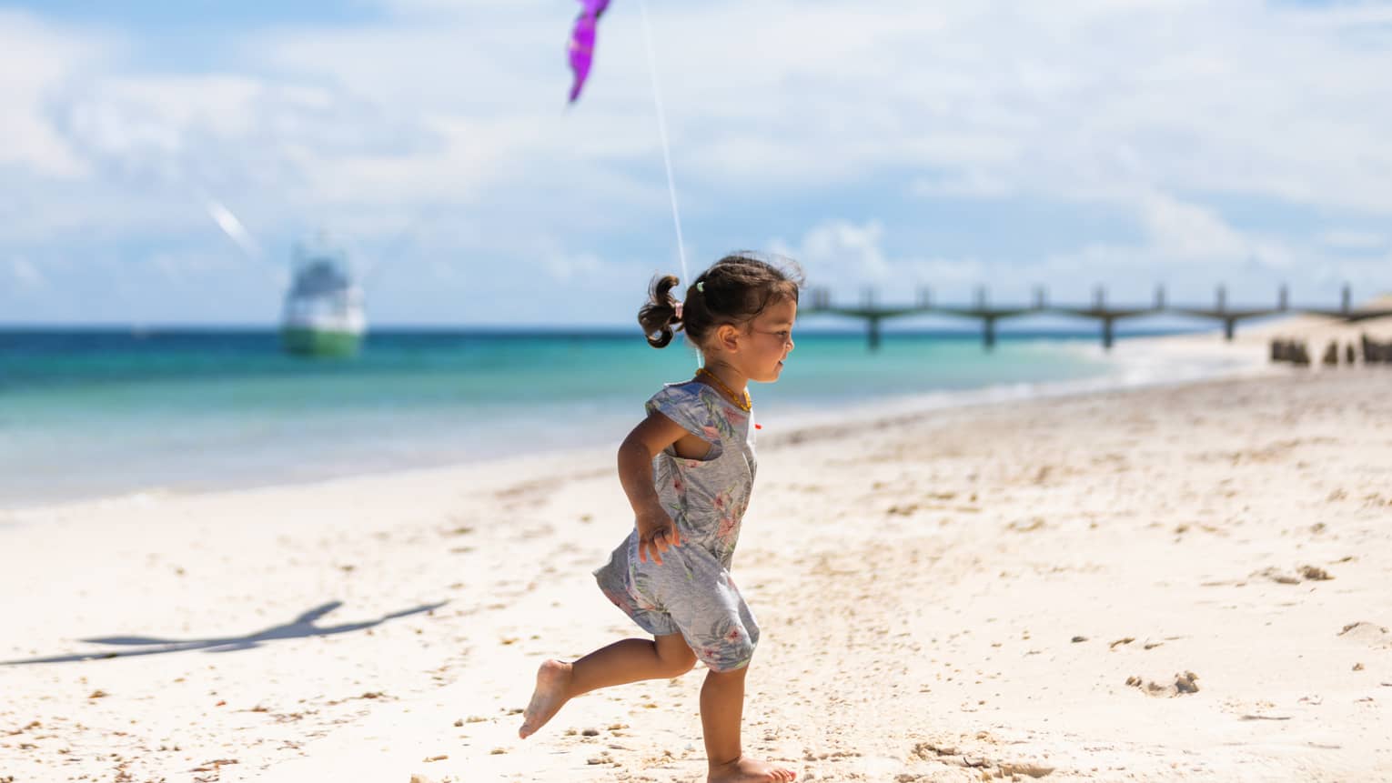 child running on the beach