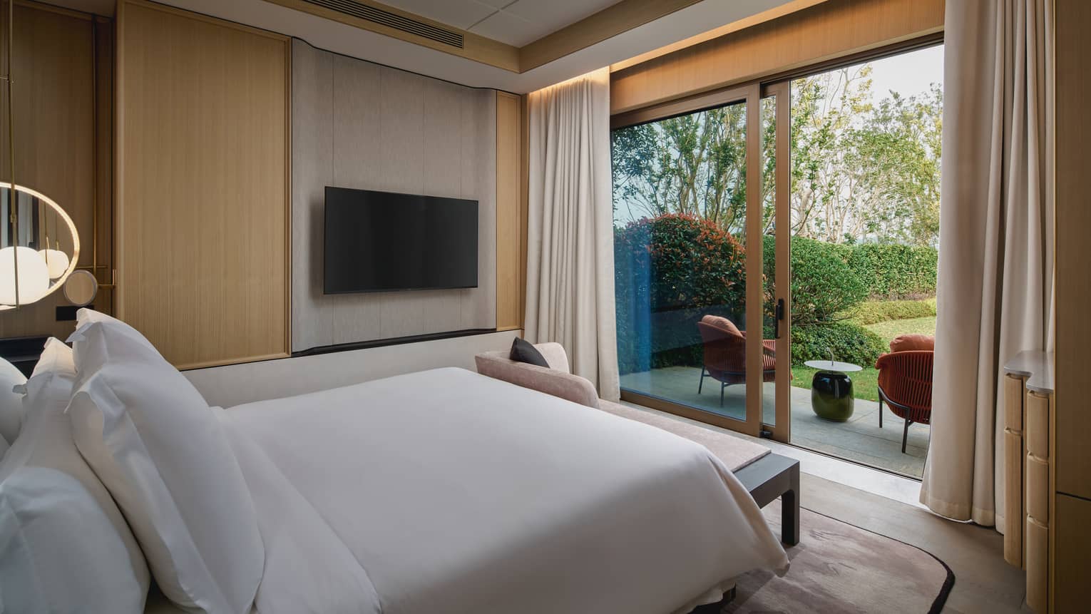 Villa bedroom with walk-out garden view at Four Seasons Hotel Suzhou