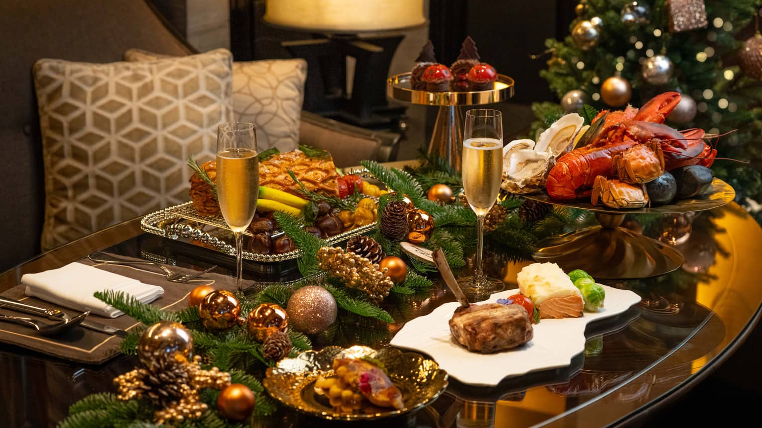Festive table spread next to Christmas tree