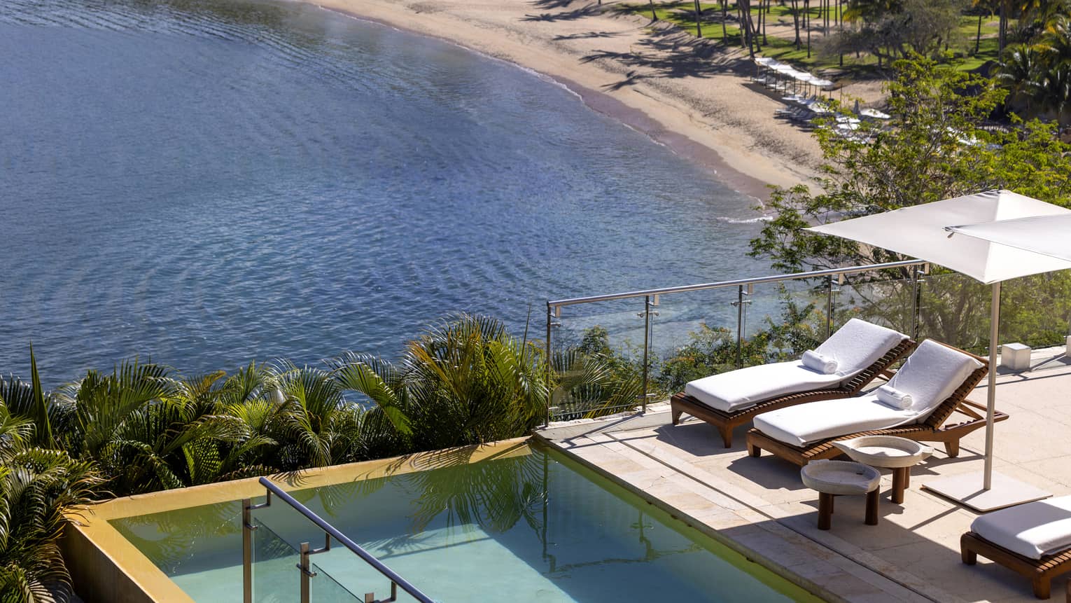 Pool and lounge chairs, overlooking Tamarindo Beach ? Casa Piedra residence at Four Seasons Resort Tamarindo, Mexico