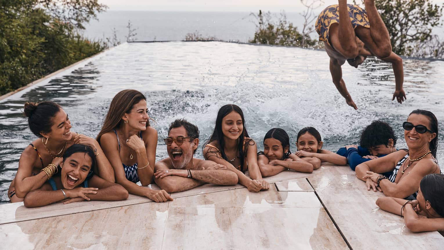 Family having fun in the pool