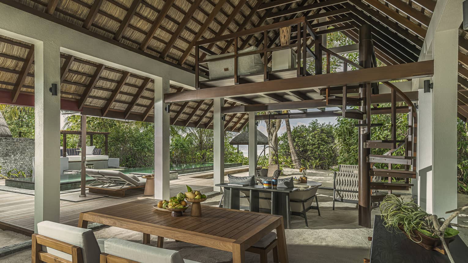 Open-air Beach Villa with Pool dining area with steepled roof and balcony