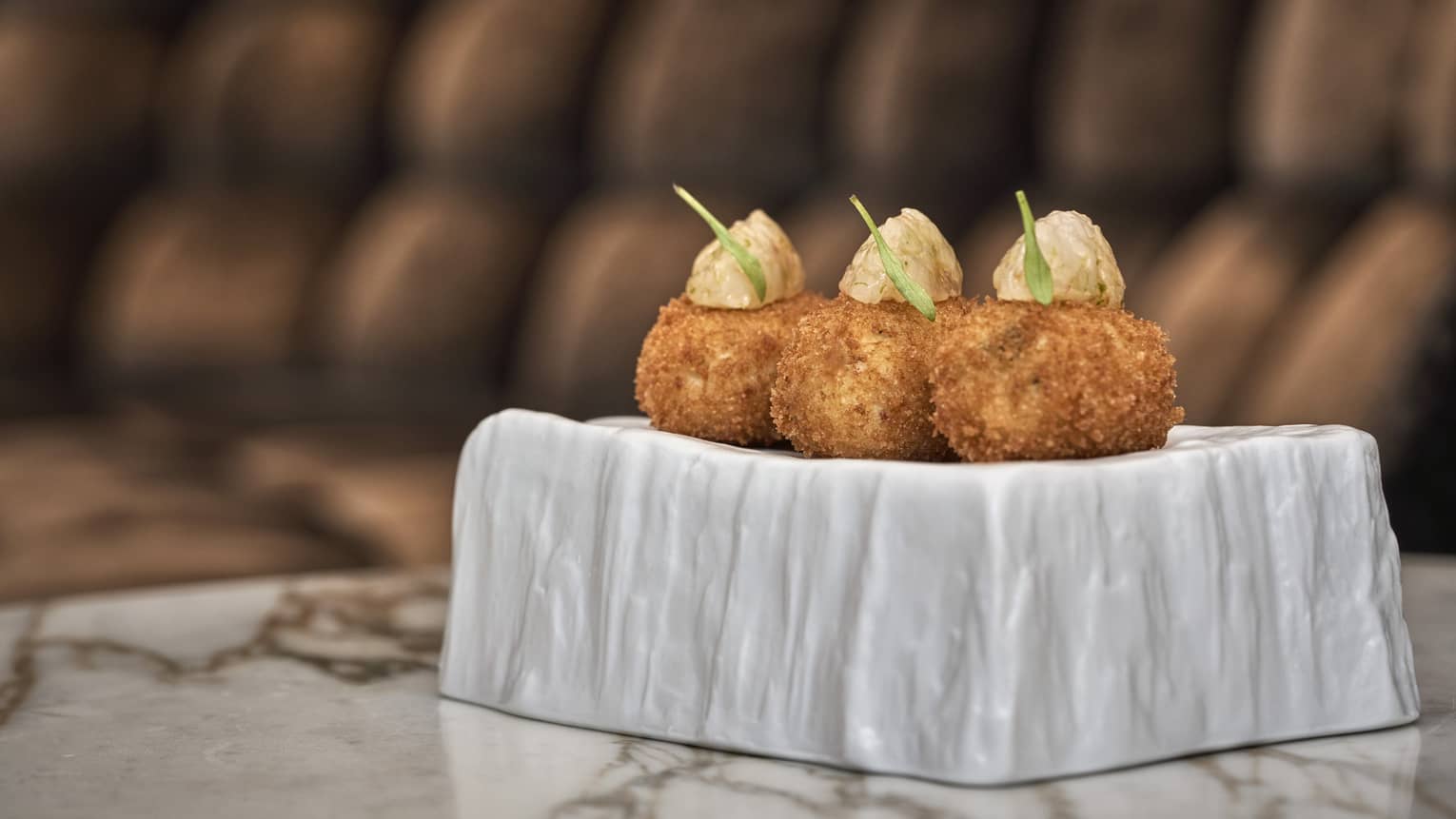 Three Free Range Chicken Croquettes with Red Shrimp on modern white plate