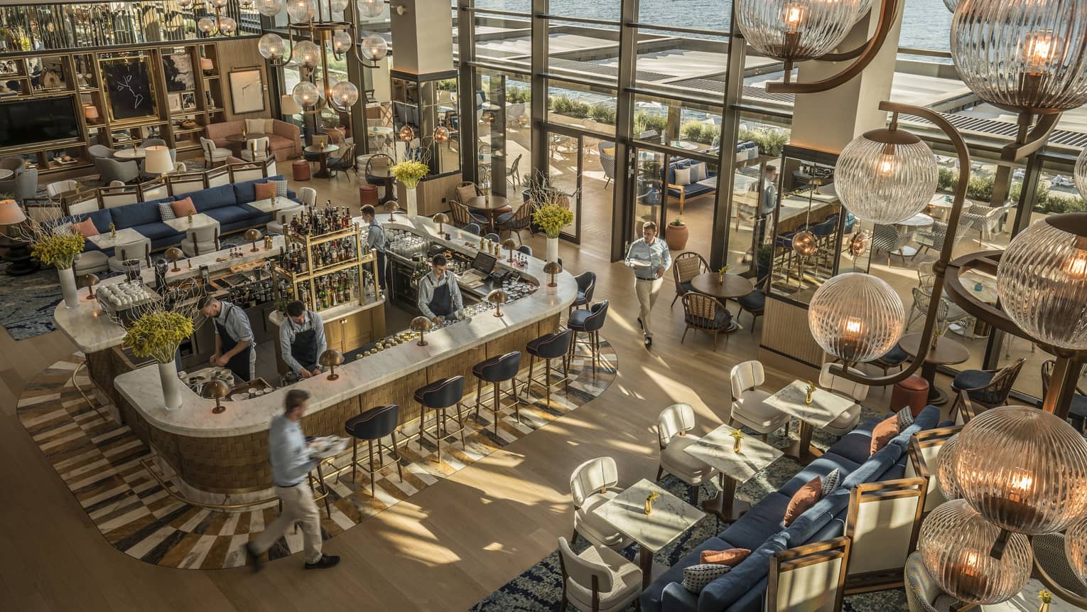 Aerial view of a contemporary restaurant with two-storey windows looking out to sea