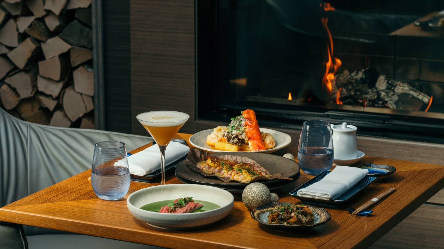Festive food on a table near a fire.