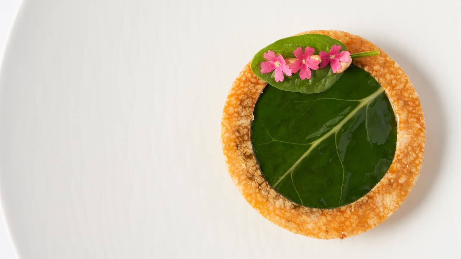  Tourta de Blea pastry with vanilla olive oil and garnish of young shoots 