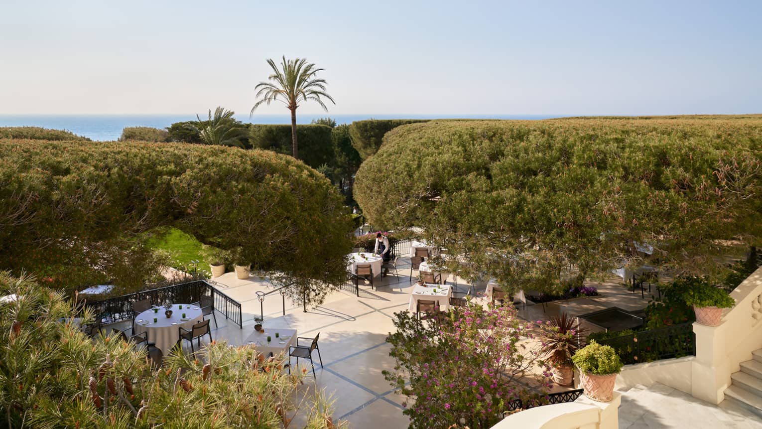 Bird’s-eye view of outdoor fine dining at luxury hotel