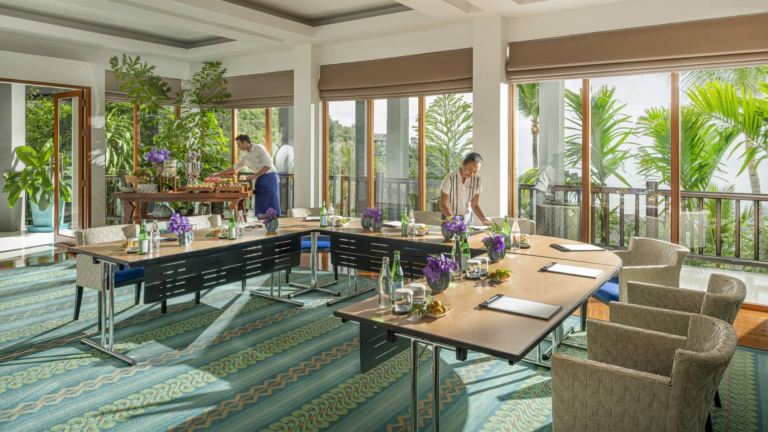 Chef and team member prepare Khob Fah meeting room for an event
