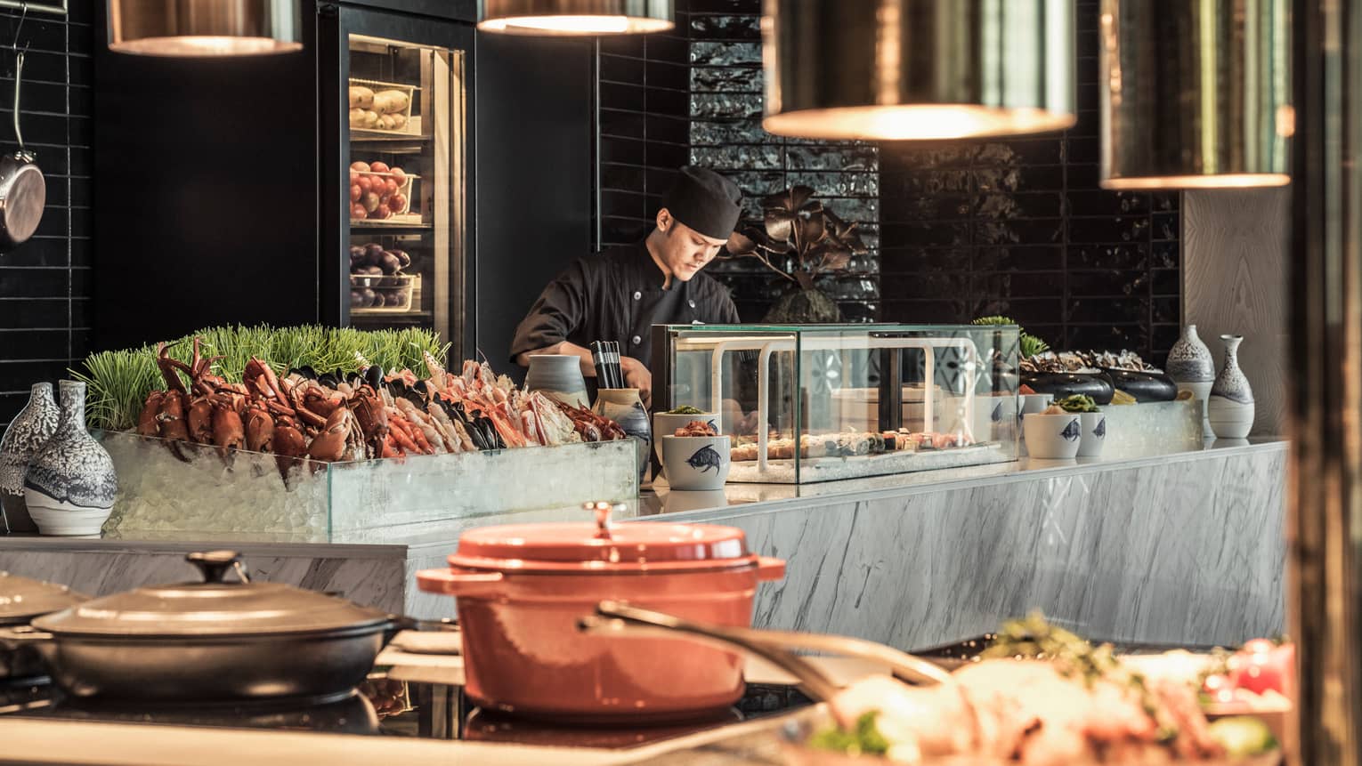 Curate buffet table with server arranging food for guests