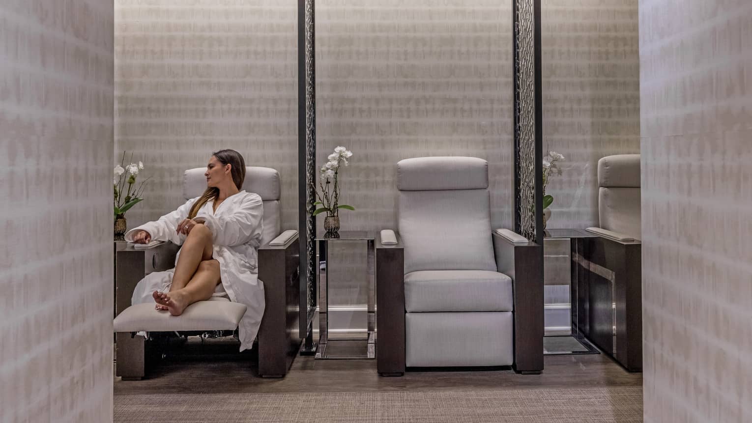 A woman in a chair in a spa.