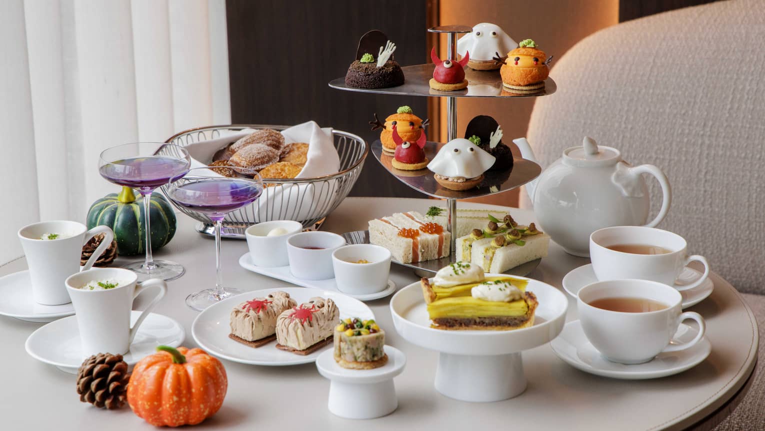 Halloween-themed afternoon tea spread on a table