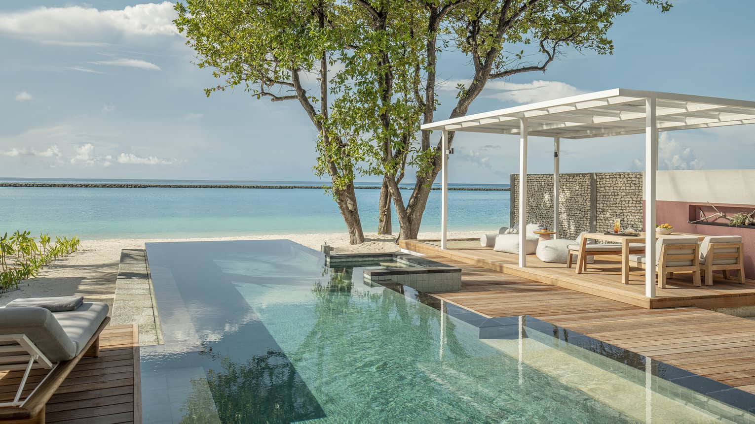 Private pool and lounge deck overlooking Maldivian ocean