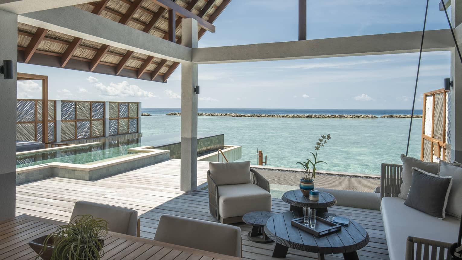 Sunrise Water Villa With Pool outdoor covered patio with swing and chair, ocean views, pool