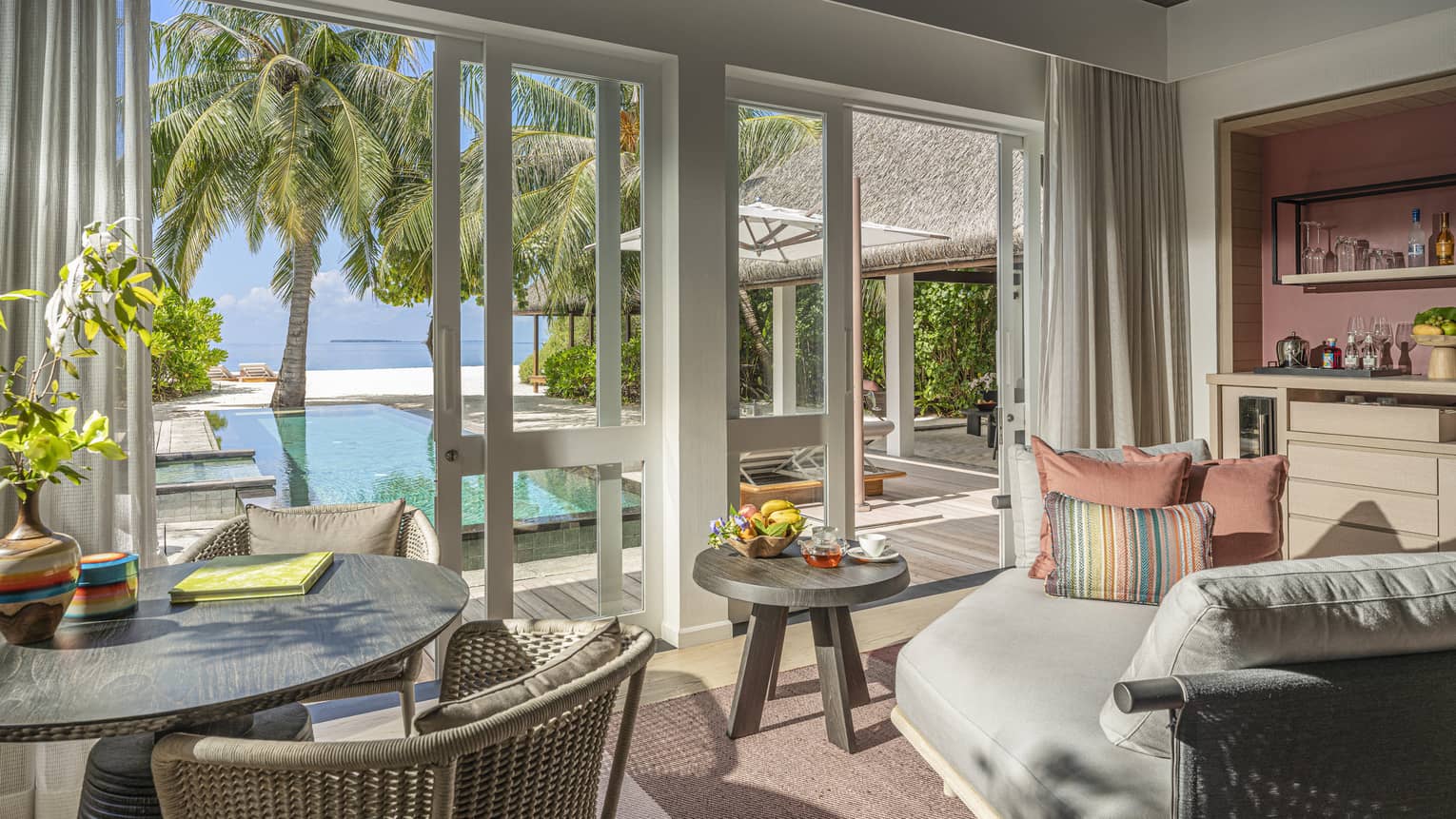 Indoor sitting area and wet bar, leading out to private pool terrace