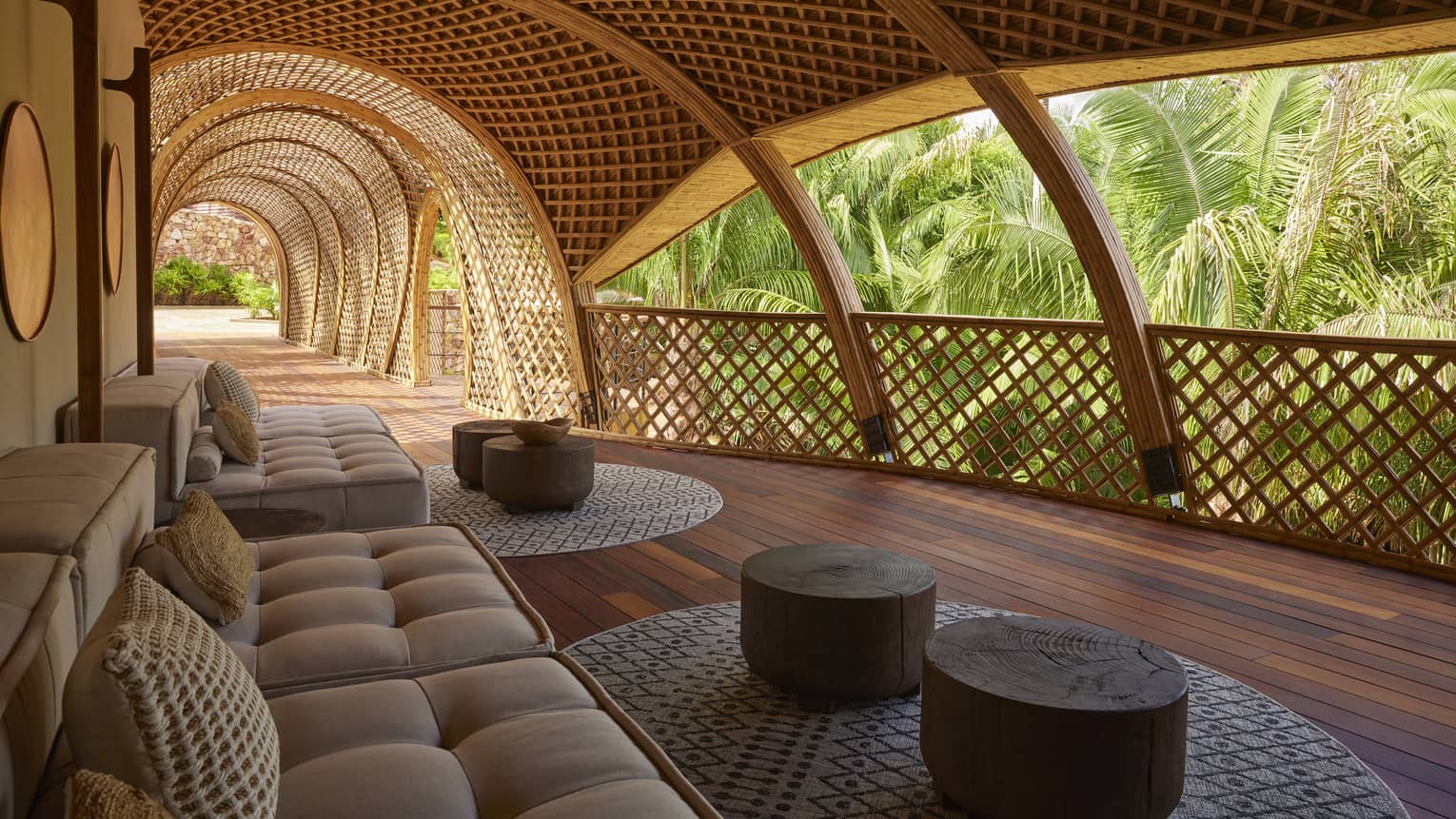 Covered indoor-outdoor lounge, surrounded by tropical forest
