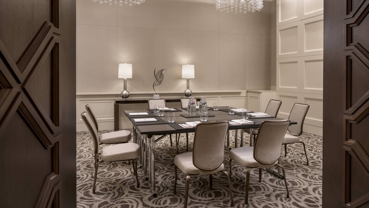 View through doors to small meeting table in Pindo room
