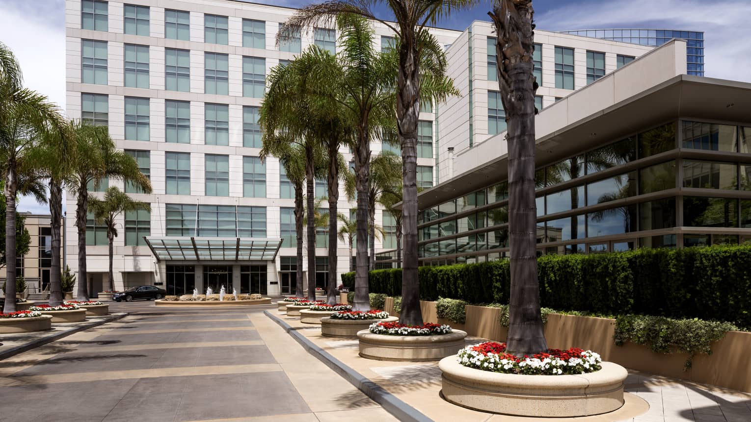 Four Seasons Hotel Silicon Valley at East Palo Alto exterior courtyard, potted palm trees