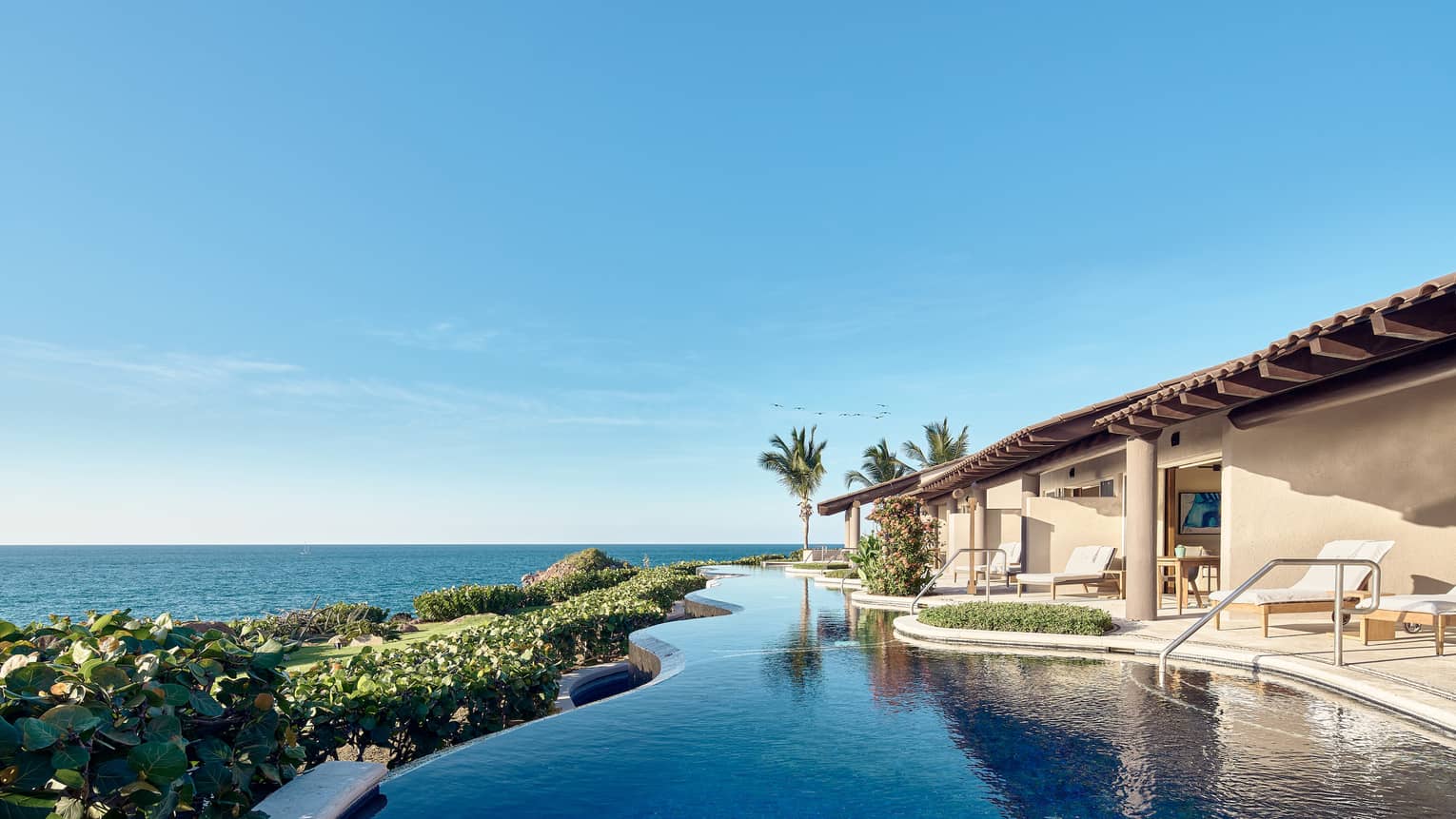 Exterior of the Sol 5 Bedroom Villa in Mexico with infinity edge pool. Outdoor terrace and ocean views.