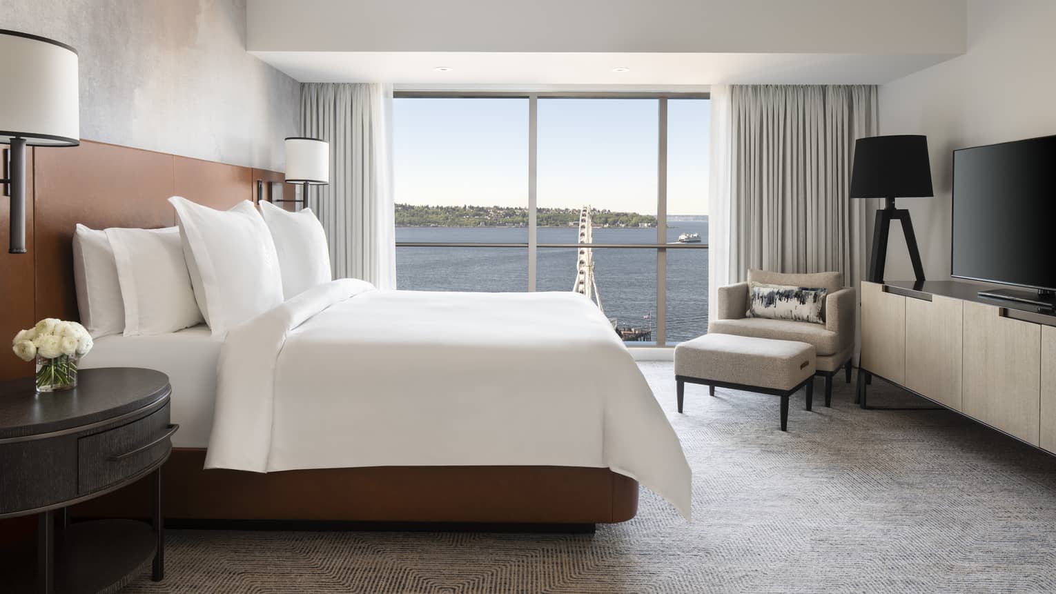 The Deluxe Elliot Bay Suite overlooks the Seattle Great Wheel