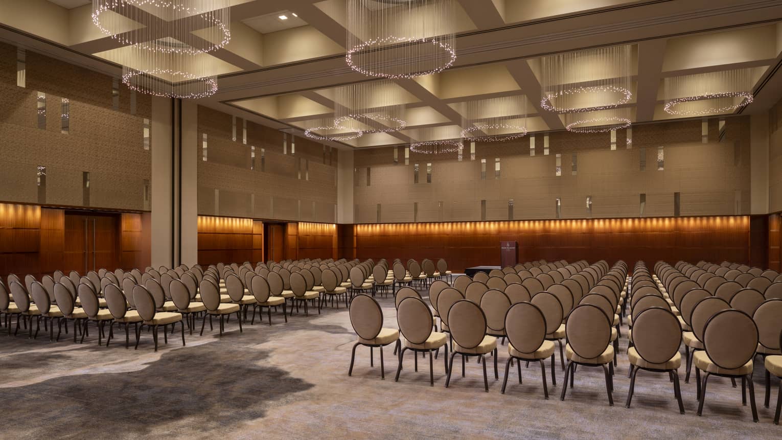 A large room with rows of chairs.