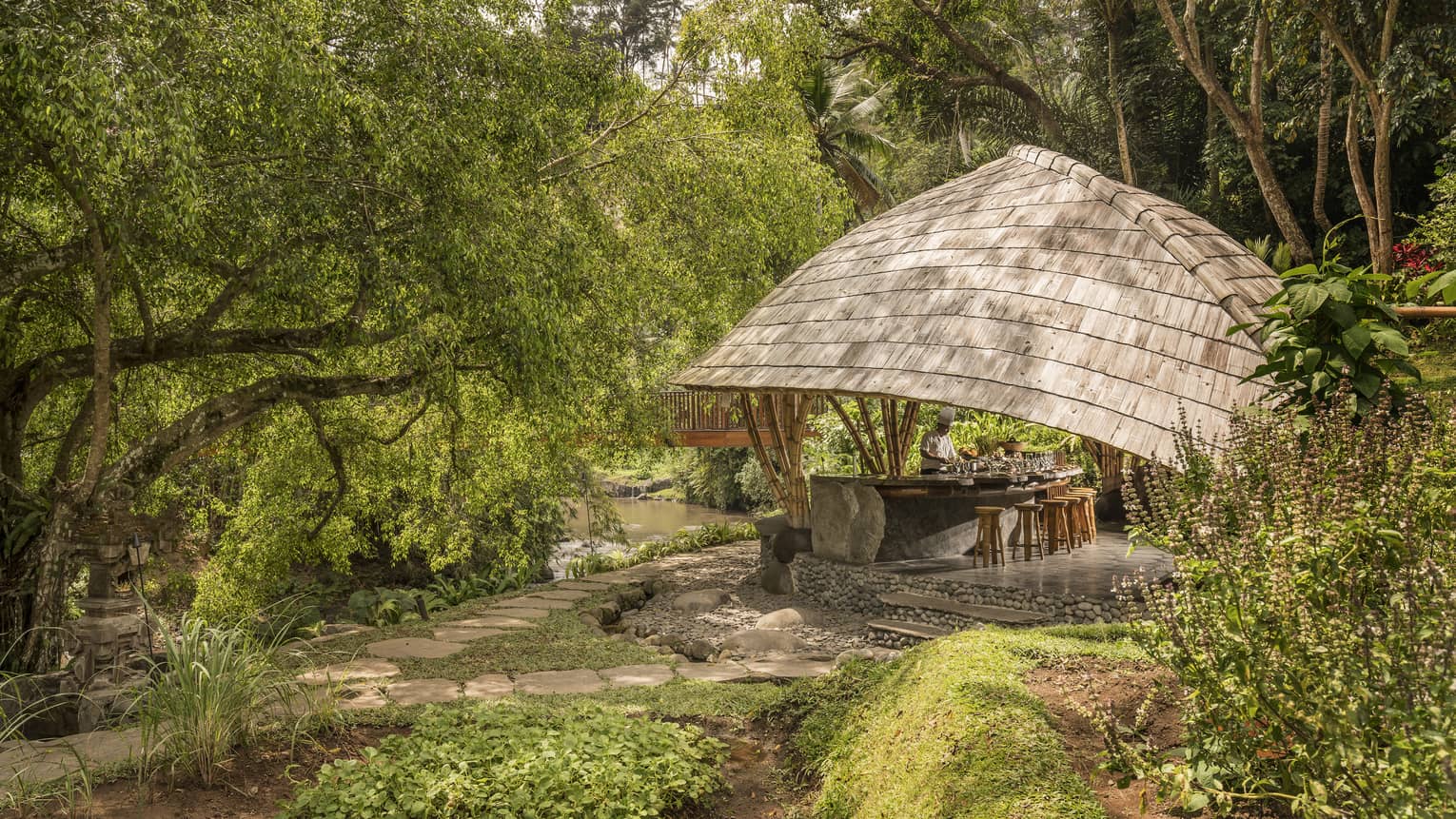 Four Seasons guests attend Sokasi Cooking School in an outdoor pavillion