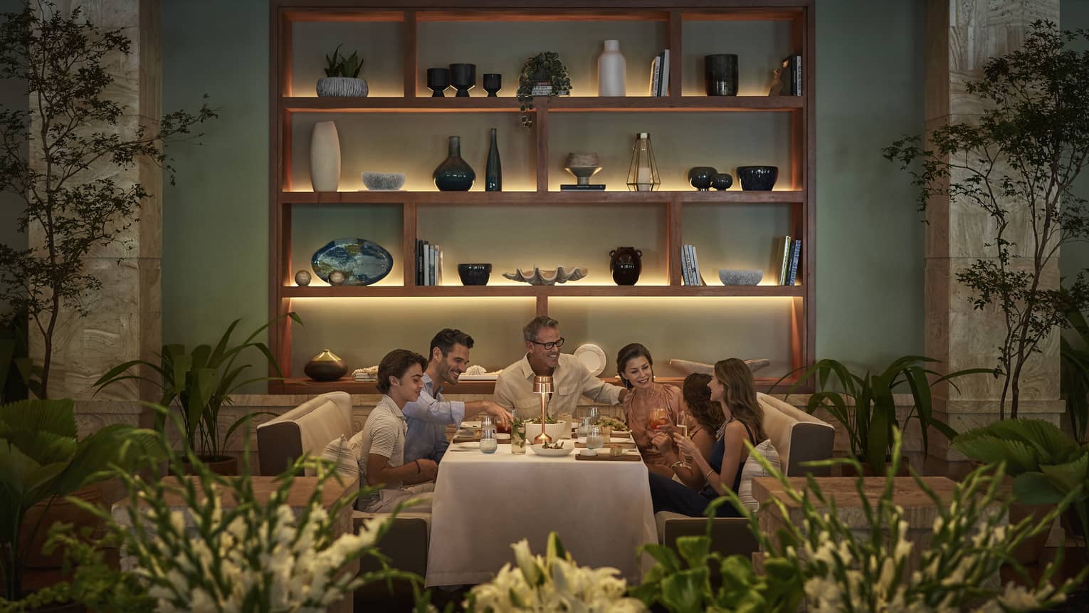 Family eating together in a warmly lit dining room