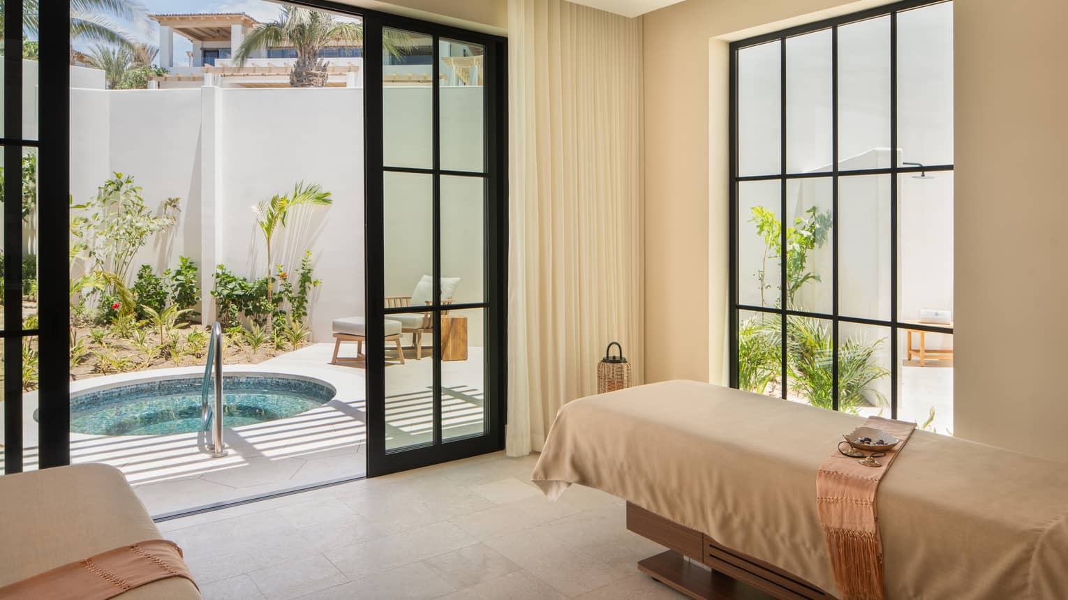 Luxury spa treatment room with access to private outdoor tub at Four Seasons Resort Cabo San Lucas at Cabo Del Sol