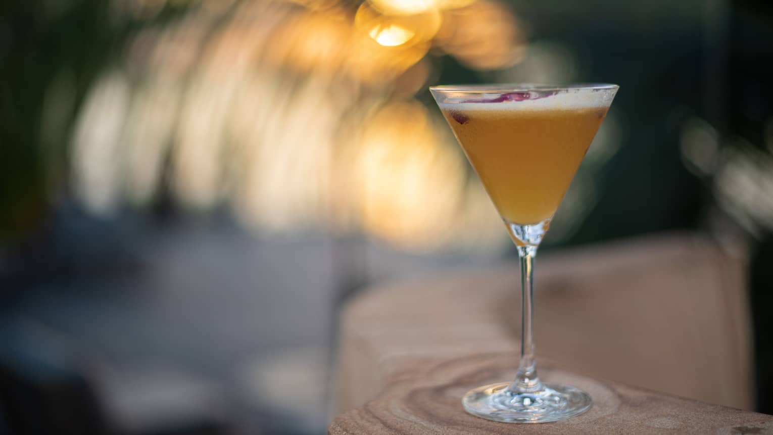 Cocktail in martini glass on bar at Four Seasons Anguilla Sunset Lounge 