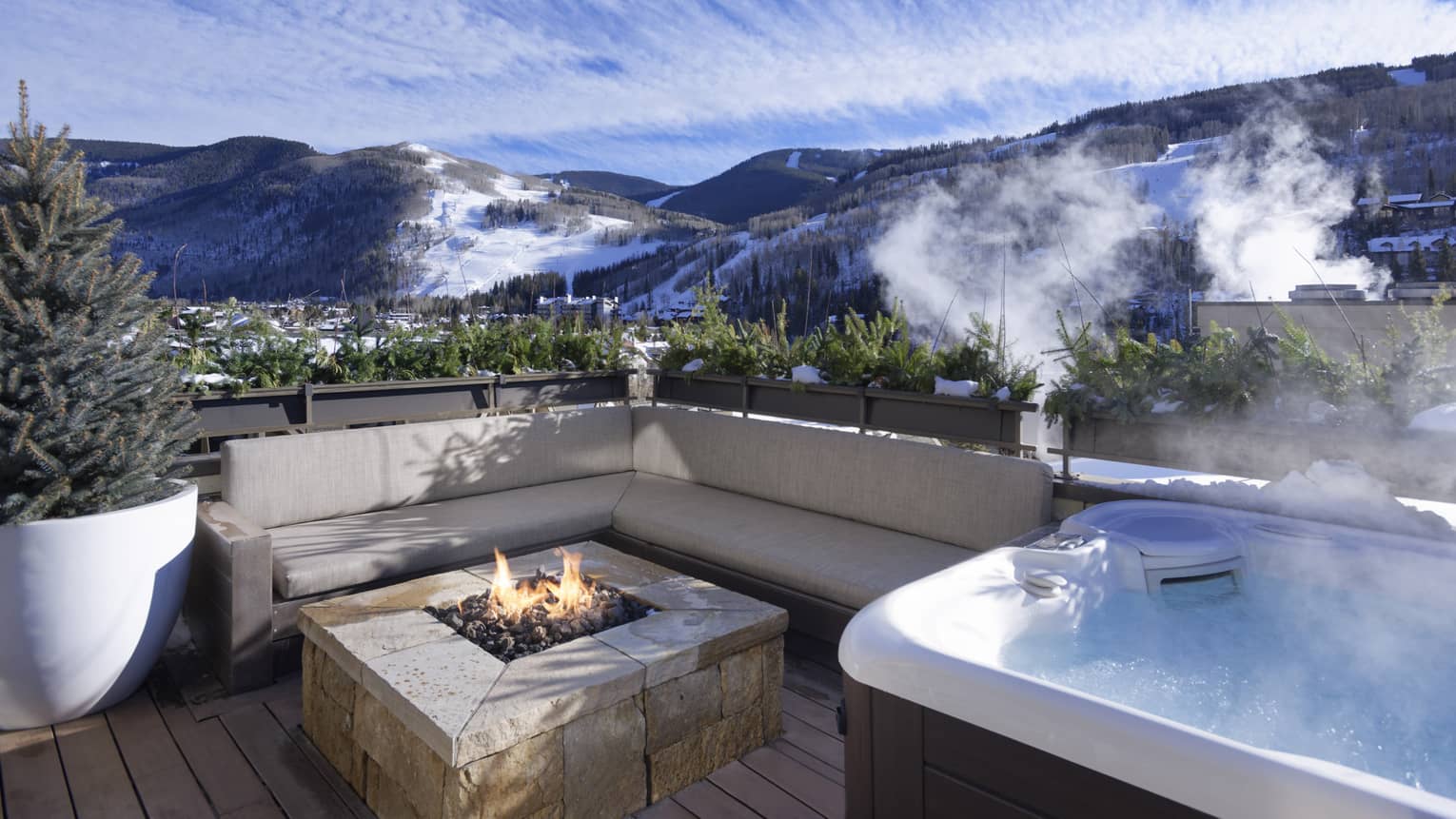 Hot tub and lounge sofa with fireplace