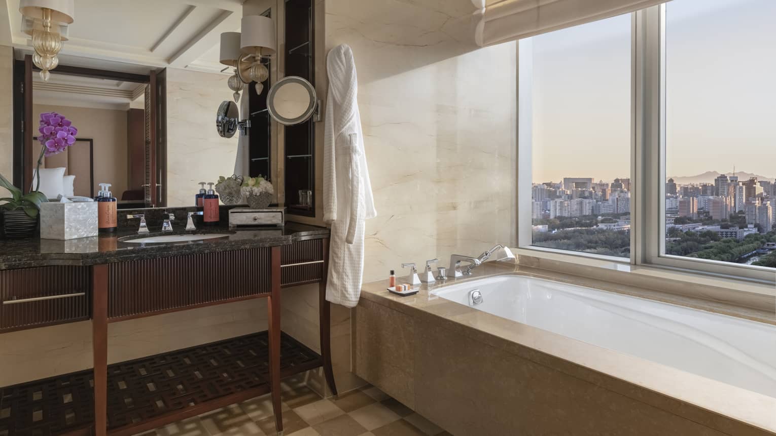 Bathroom with tan and cream square tiled floor and window-side tub