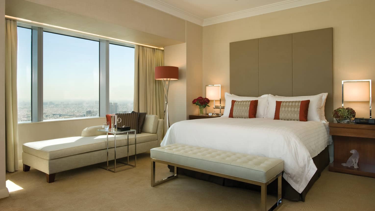 Sunny Executive Suite with brown, beige and ivory decor, long chaise under window
