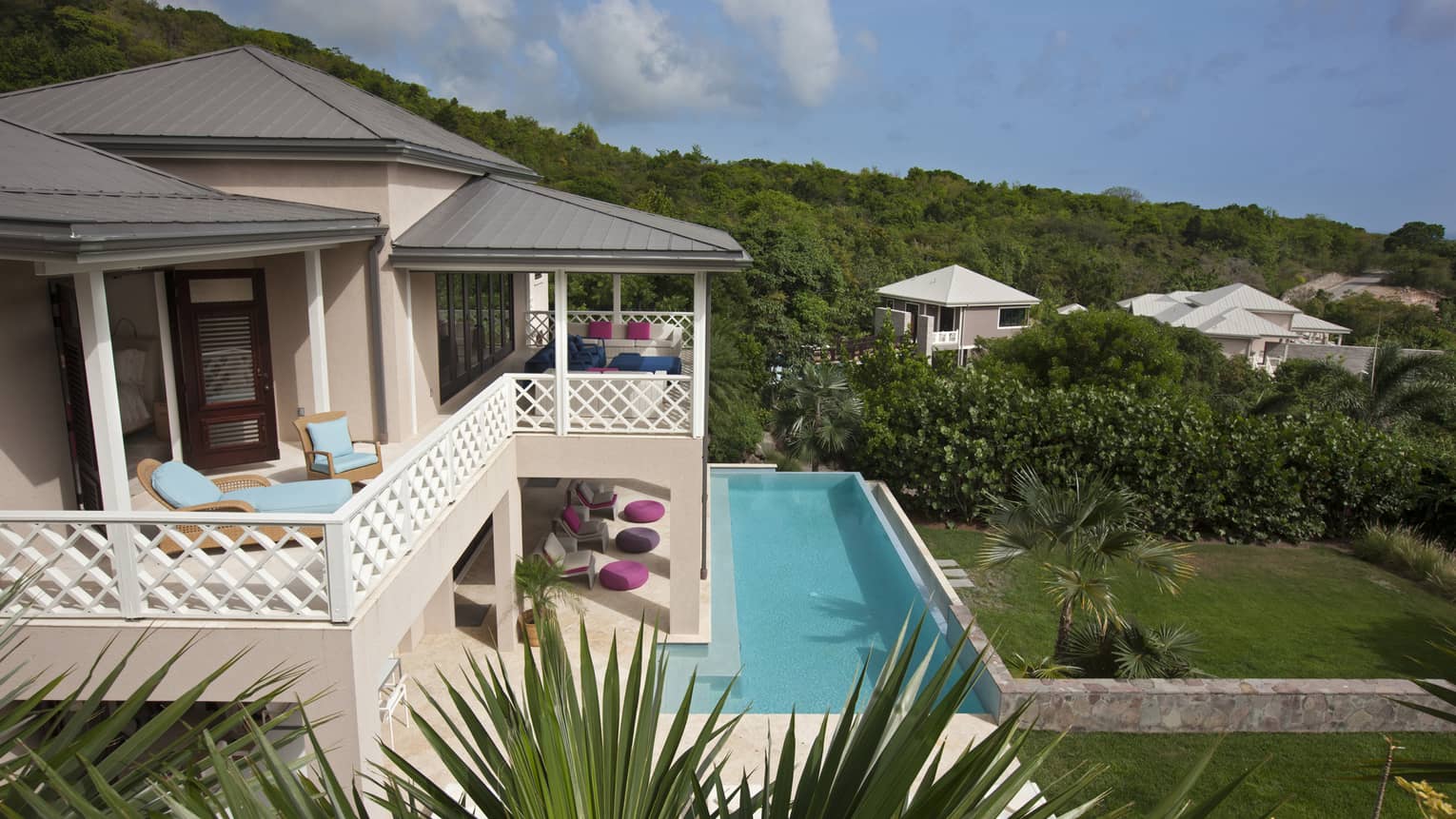 Looking down over Stewarts Residence pink exterior, upstairs balcony, outdoor pool