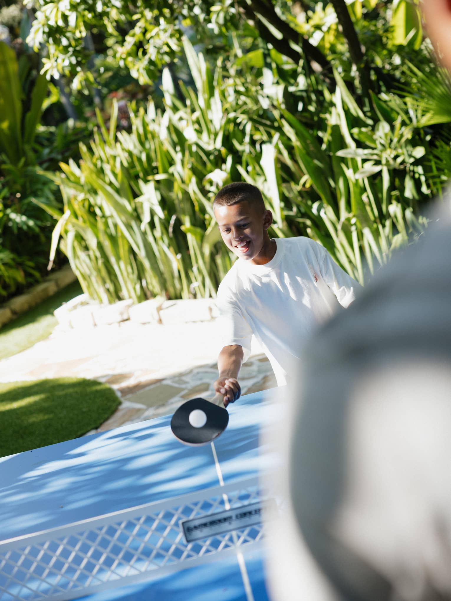 Family plays ping pong